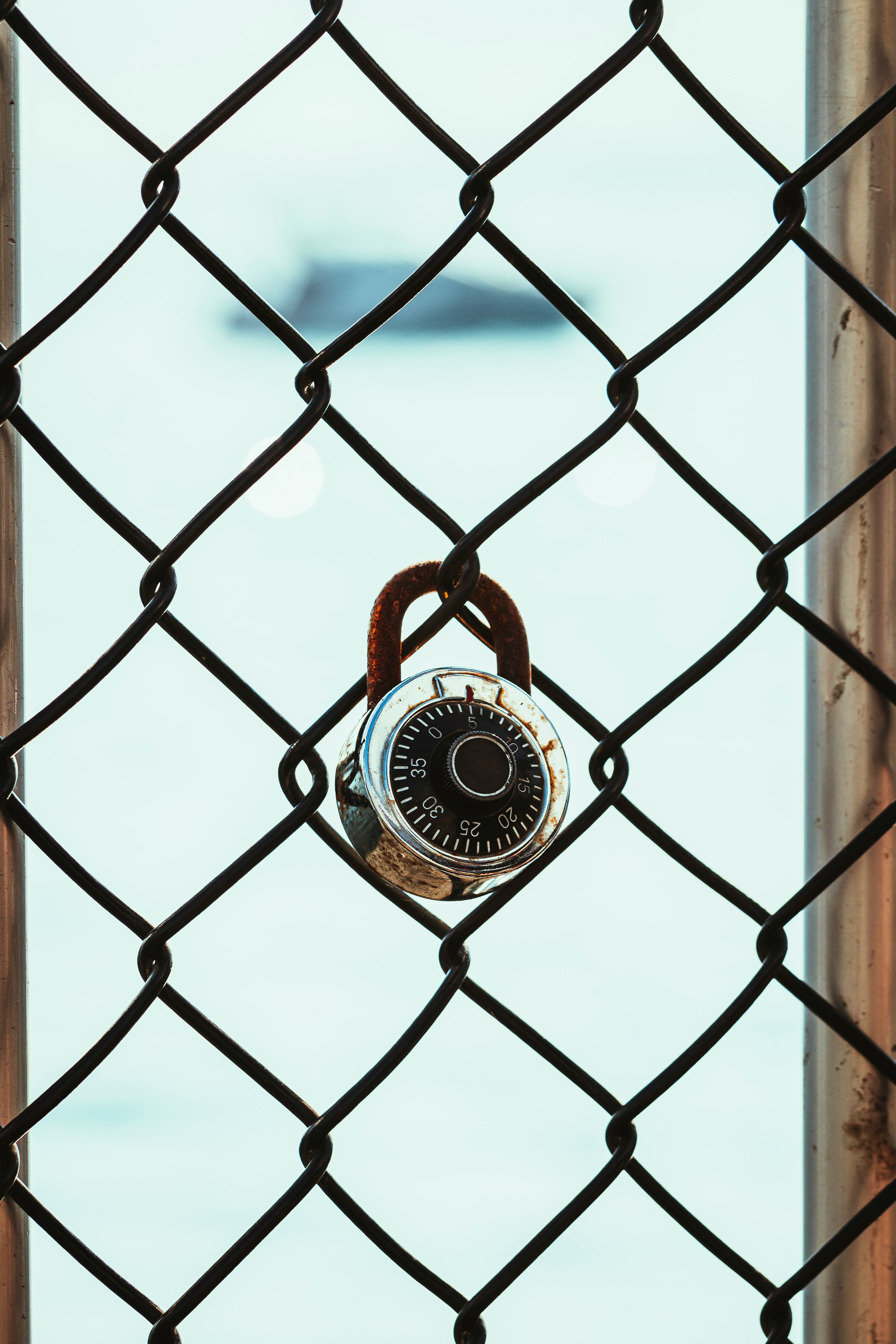 black metal fence with padlock